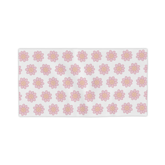 Colorful Delulu Floral Beach Towel draped over beach chair, showcasing its playful design that turns heads while you pretend to star in your own coming-of-age movie.