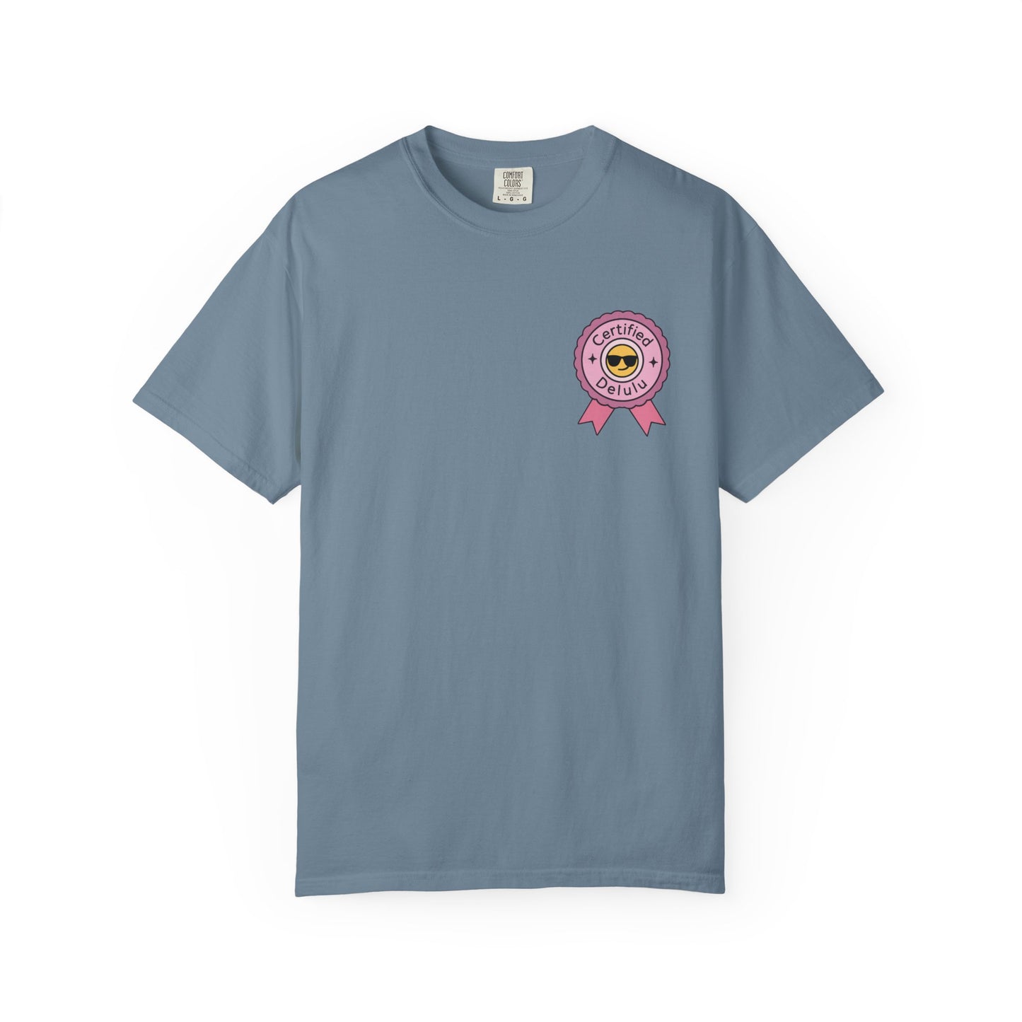 Model wearing the Certified Delulu Badge Comfort Tee while manifesting dreams in a cozy setting, showing off its vintage-like feel and relaxed fit.