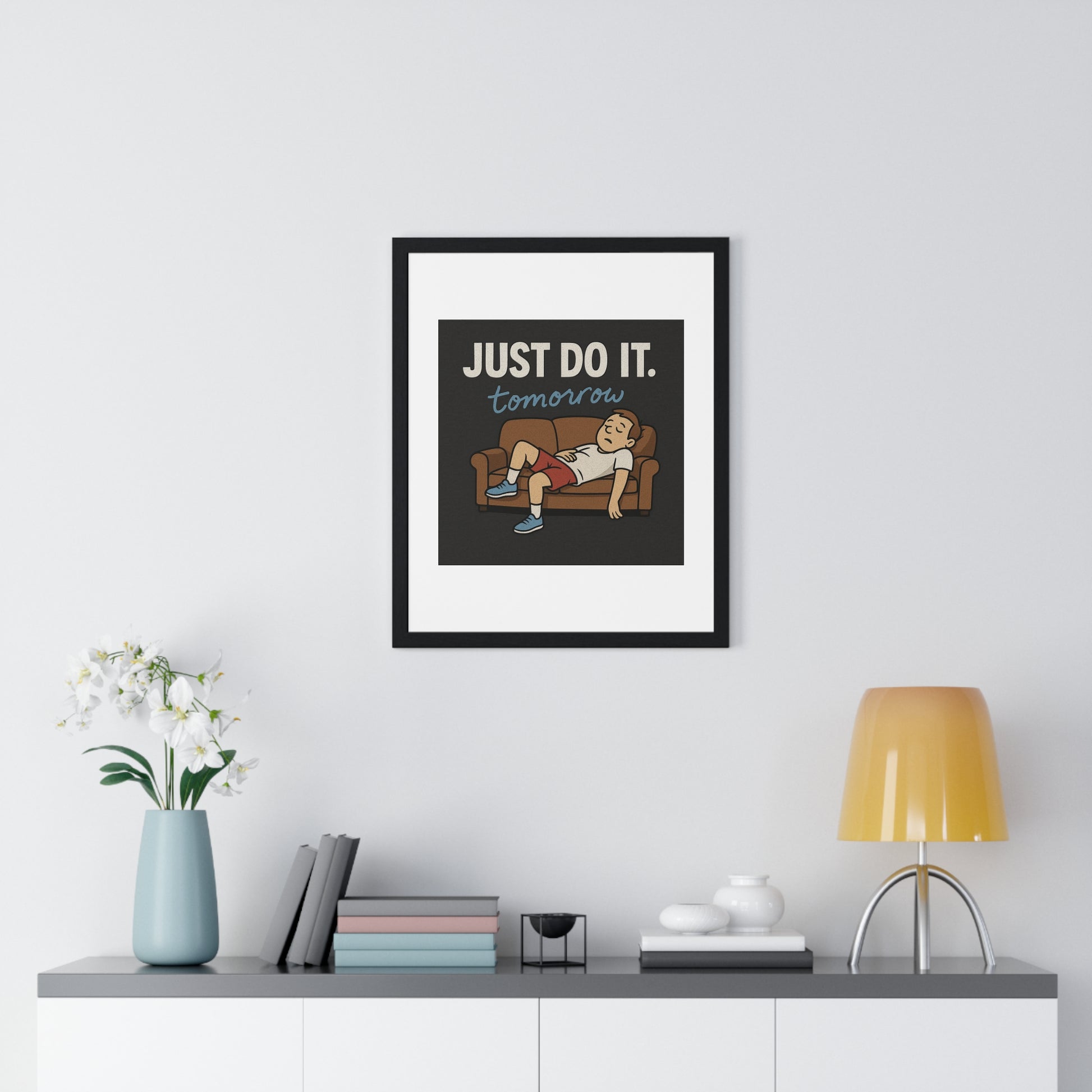 Framed motivational poster 'Just Do It... Tomorrow' that humorously celebrates the art of delay in a stylish way.
