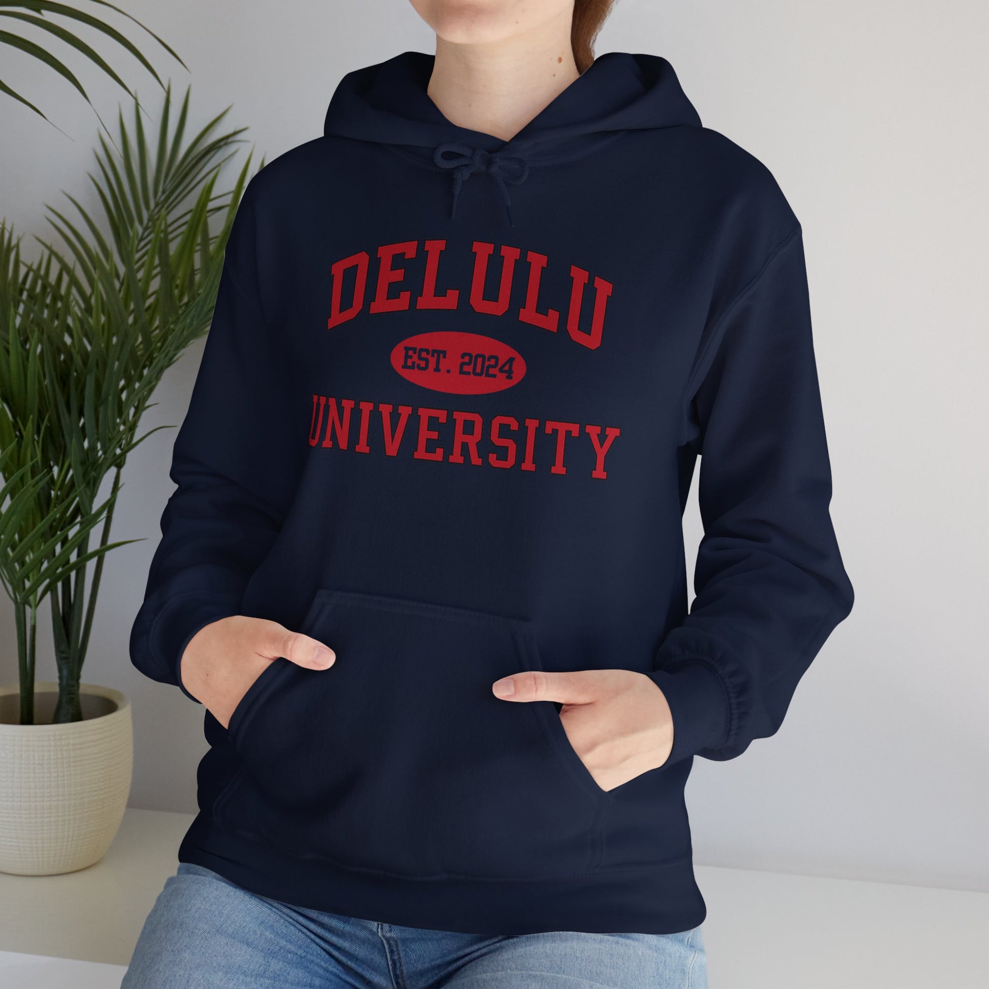 Delulu University Hoodie – Enroll in Chaos, Graduate in Vibes, epitomizing the fun spirit of college life in a cozy hoodie.