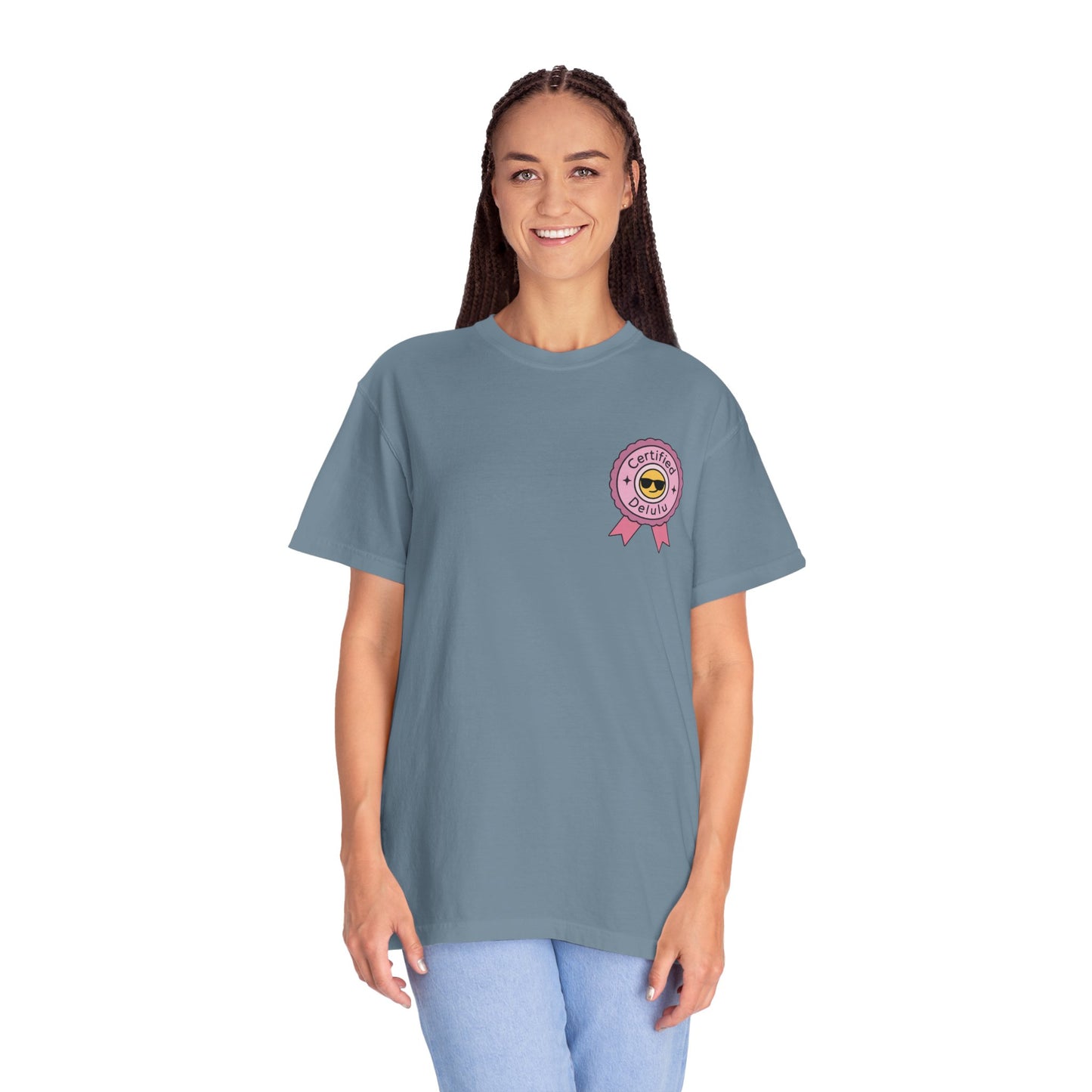 Certified Delulu Badge Comfort Tee elegantly folded, presenting a cozy invitation to dive into the world of delightful delusions.