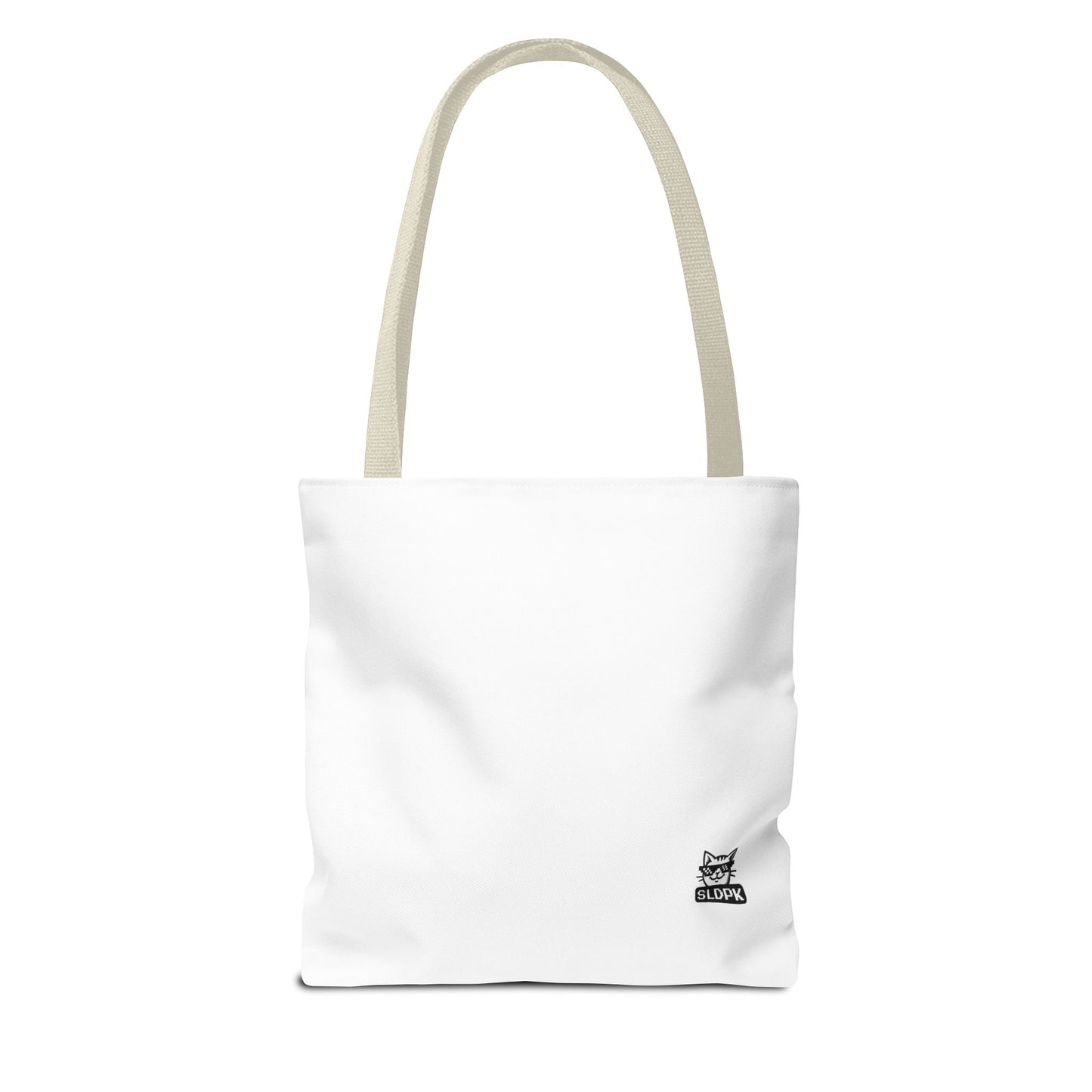 Aesthetic close-up of 'Just Do It… Tomorrow' tote bag in a trendy workspace.