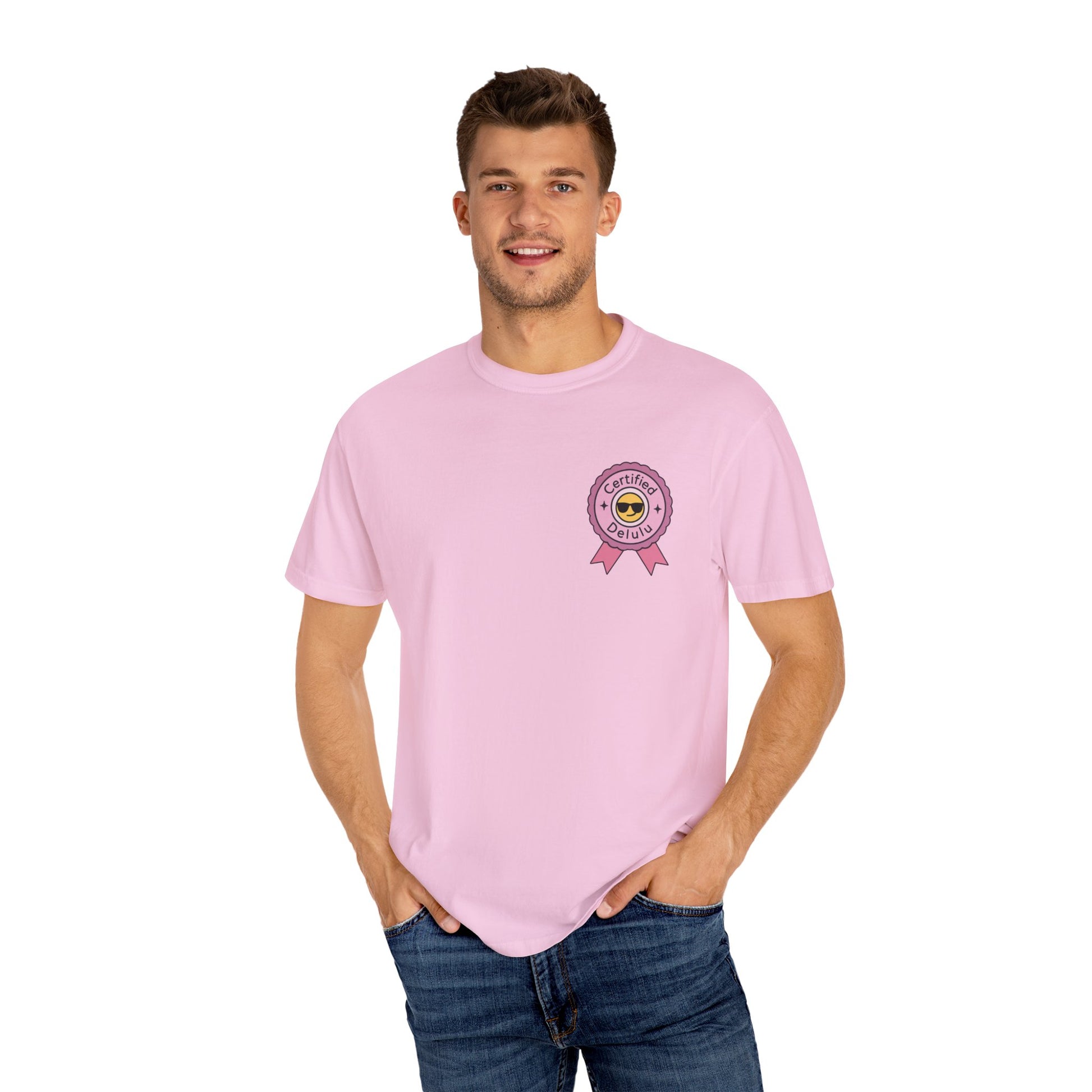 Masterpiece display of the Certified Delulu Badge Comfort Tee, inviting you to wear your dreams and join the fun surrounding this comfy classic.