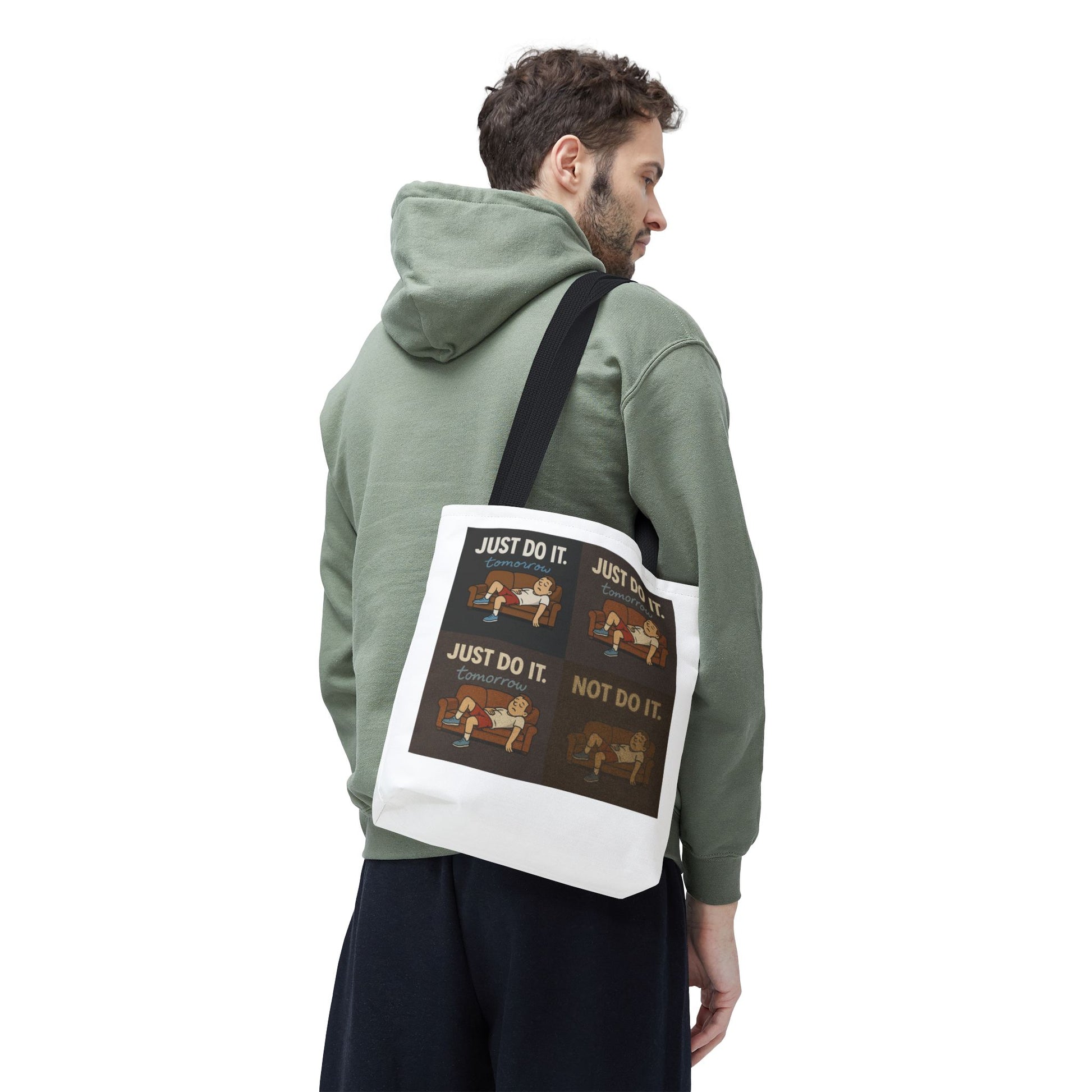 Person lounging on a couch with 'Just Do It… Tomorrow' tote bag casually nearby.