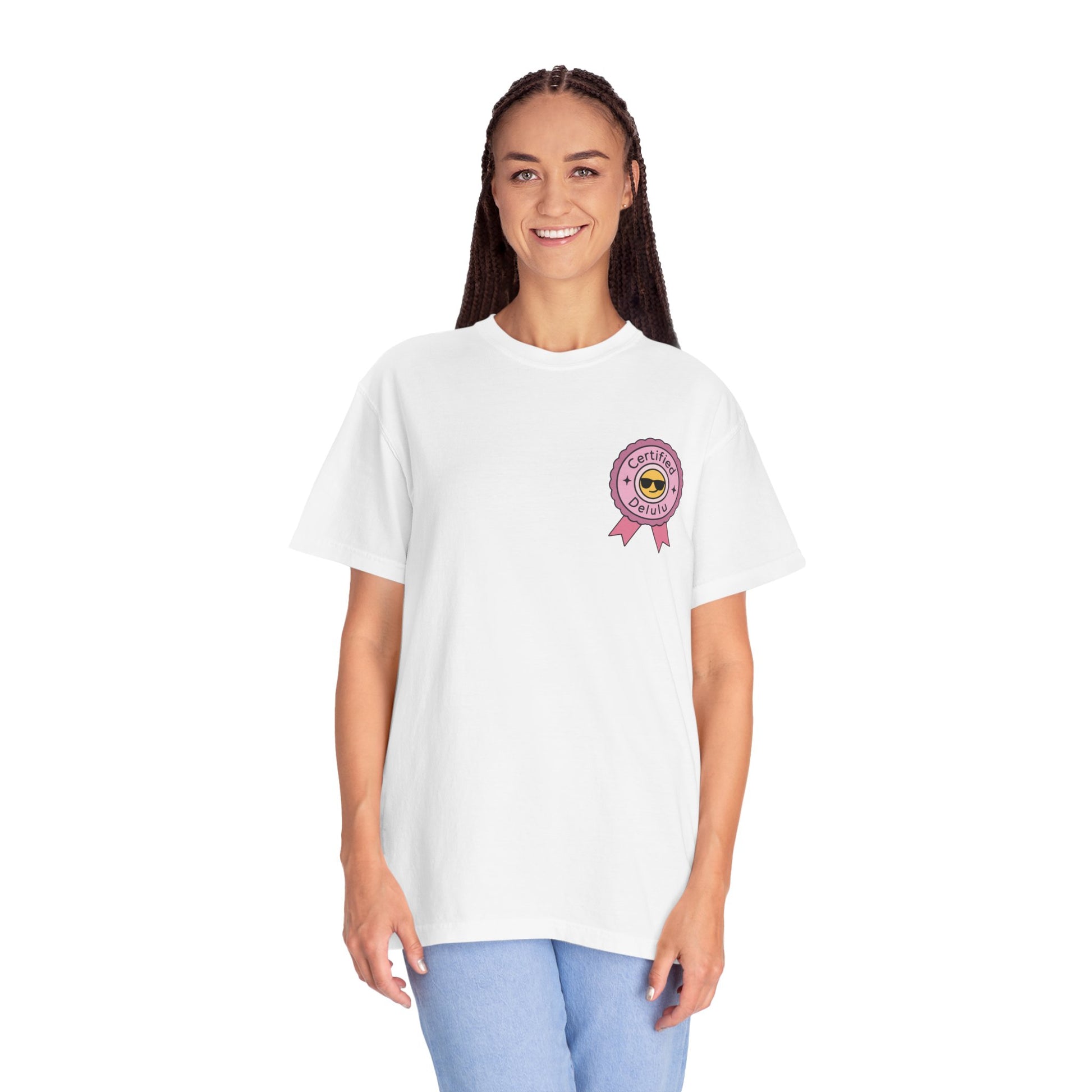 Flat lay of the Certified Delulu Badge Comfort Tee with accessories, perfect for Instagram aesthetic shots and subtle meme flexing.